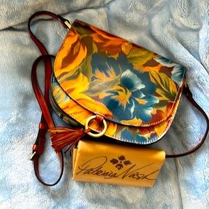 Patricia Nash crossbody bag.  Multi-color floral leather w/inside wallet.